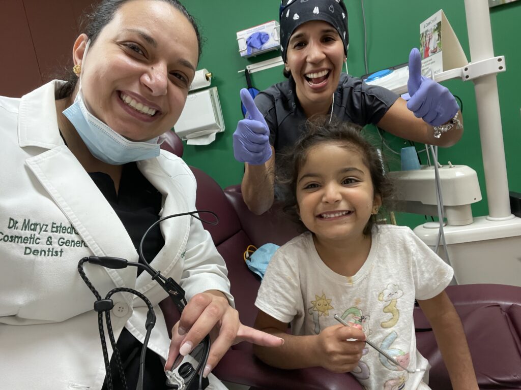 DR. MARYZ ESTEDRAK AND EVERSMILE DENTAL TEAM CELEBRATING PATIENT SMILE RESULTS - EVERSMILE DENTAL NJ